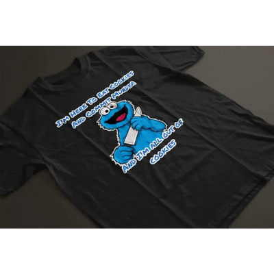 Black out of cookies t-shirt with blue cartoon character holding a knife and humorous text